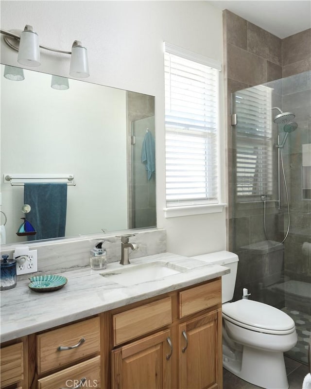 1417 23rd St, Oceano, CA 93445 - full bathroom with a tile shower, vanity, toilet, and tile patterned floors
