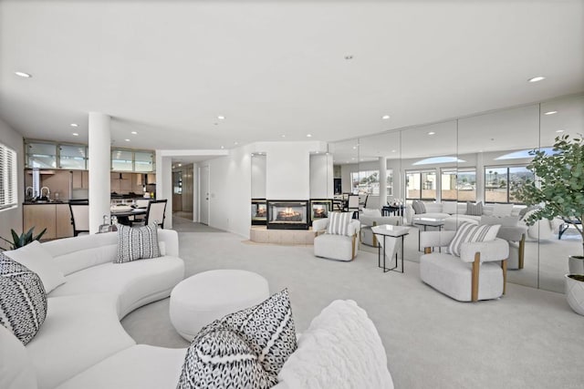 3868 Riviera Dr Unit 4A, San Diego, CA 92109 - living room with carpet floors, recessed lighting, and a multi sided fireplace