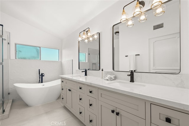 2402 Pepperdale Dr, Rowland Heights, CA 91748 - bathroom featuring double vanity, vaulted ceiling, a freestanding bath, a stall shower, and a chandelier