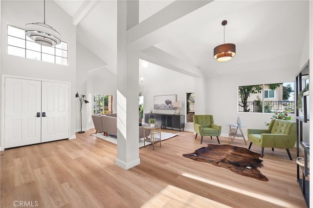 2402 Pepperdale Dr, Rowland Heights, CA 91748 - entryway with high vaulted ceiling, plenty of natural light, light wood-style floors, and baseboards