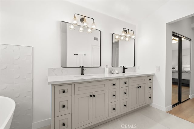2402 Pepperdale Dr, Rowland Heights, CA 91748 - ensuite bathroom with double vanity, a freestanding bath, and baseboards