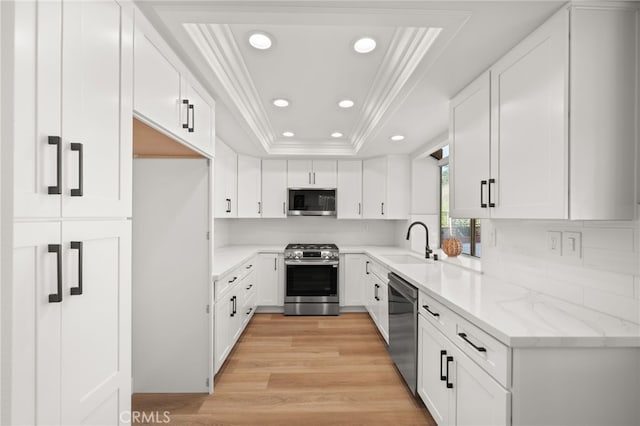 2402 Pepperdale Dr, Rowland Heights, CA 91748 - kitchen with stainless steel appliances, ornamental molding, a sink, a tray ceiling, and recessed lighting