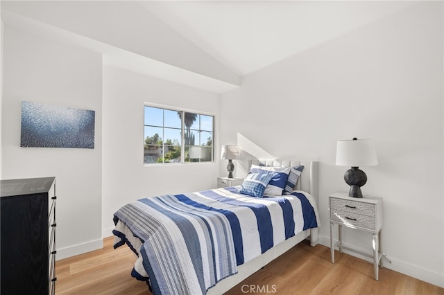 2402 Pepperdale Dr, Rowland Heights, CA 91748 - bedroom with wood finished floors, lofted ceiling, and baseboards
