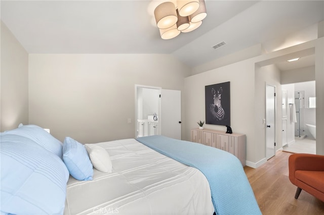 2402 Pepperdale Dr, Rowland Heights, CA 91748 - bedroom featuring light wood-style floors, vaulted ceiling, ensuite bathroom, and baseboards