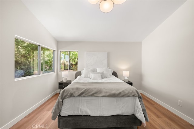 2402 Pepperdale Dr, Rowland Heights, CA 91748 - bedroom featuring baseboards, lofted ceiling, and light wood-style flooring