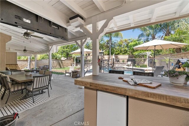 22011 Iron Horse Pl, Saugus, CA 91390 - fenced backyard with outdoor dining space, a patio area, and ceiling fan