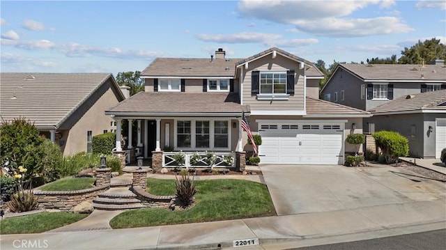 22011 Iron Horse Pl, Saugus, CA 91390 - traditional-style house featuring covered porch, driveway, stucco siding, and a tiled roof