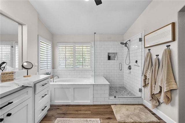 22011 Iron Horse Pl, Saugus, CA 91390 - bathroom with a shower stall, a bath, wood finished floors, vanity, and lofted ceiling
