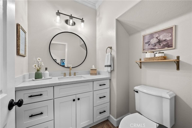 22011 Iron Horse Pl, Saugus, CA 91390 - half bathroom with toilet, vanity, and ornamental molding