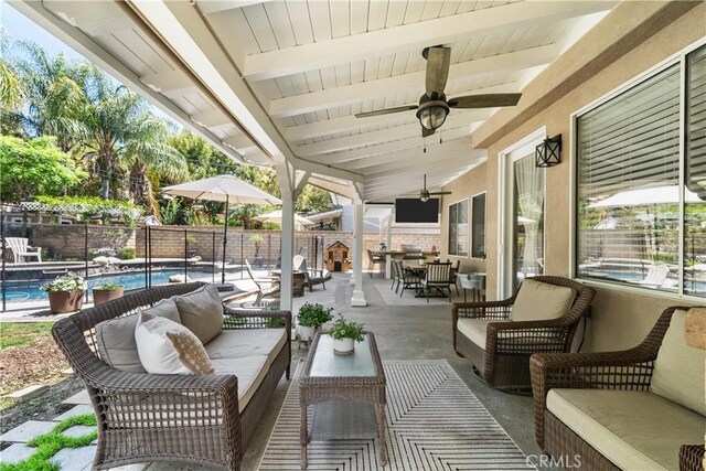 22011 Iron Horse Pl, Saugus, CA 91390 - fenced backyard featuring outdoor lounge area, a ceiling fan, and a patio