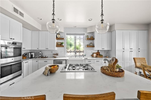 22011 Iron Horse Pl, Saugus, CA 91390 - kitchen with open shelves, appliances with stainless steel finishes, a sink, decorative backsplash, and recessed lighting
