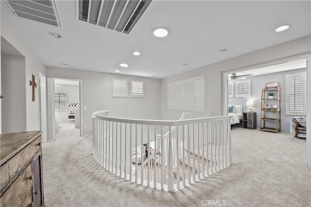 22011 Iron Horse Pl, Saugus, CA 91390 - hall with light colored carpet, recessed lighting, and an upstairs landing