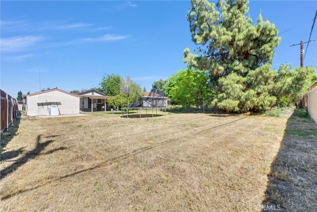 2513 Genevieve St, San Bernardino, CA 92405 - view of yard with a trampoline