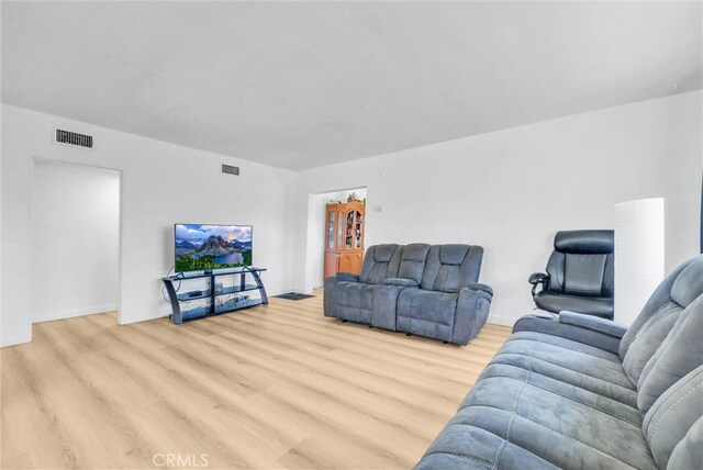 2513 Genevieve St, San Bernardino, CA 92405 - living area featuring light wood finished floors and baseboards