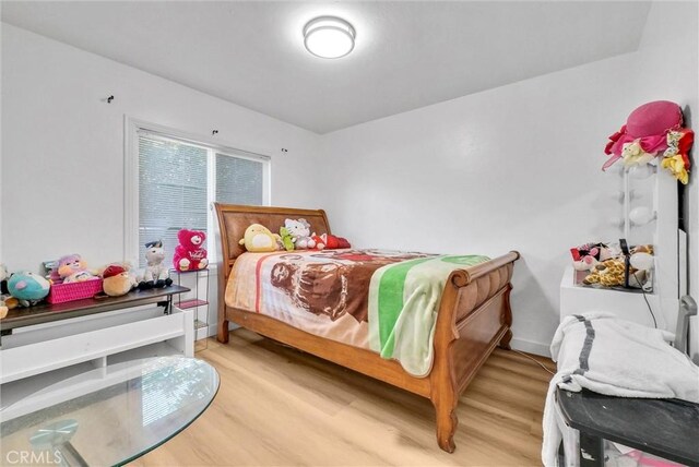 2513 Genevieve St, San Bernardino, CA 92405 - bedroom featuring light wood-type flooring