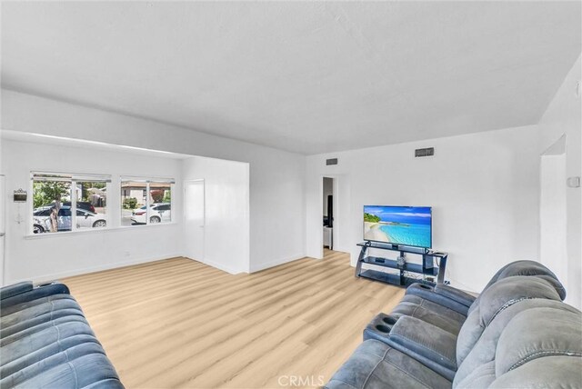 2513 Genevieve St, San Bernardino, CA 92405 - living area with wood finished floors and baseboards