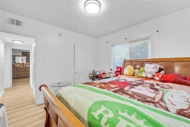 2513 Genevieve St, San Bernardino, CA 92405 - bedroom featuring light wood-type flooring and baseboards