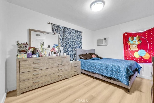 2513 Genevieve St, San Bernardino, CA 92405 - bedroom featuring wood finished floors and an AC wall unit