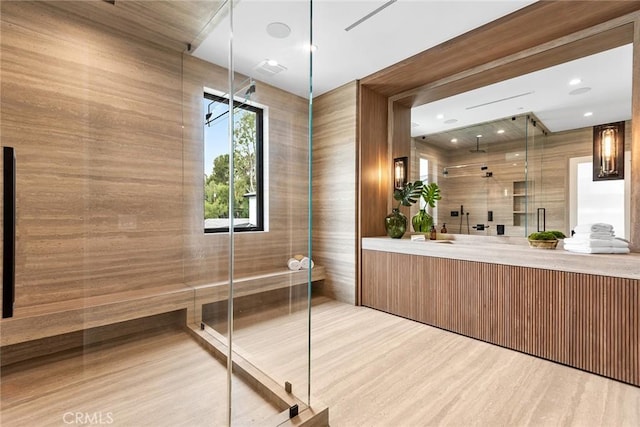 full bathroom with a stall shower, wood finished floors, and vanity