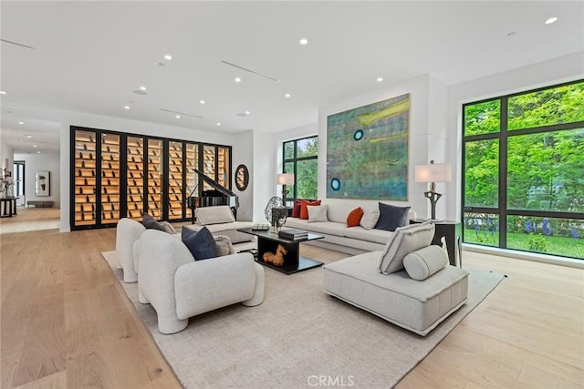 living room featuring recessed lighting and wood finished floors