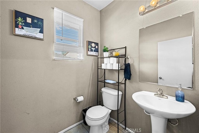 3260 Ivy Ct, Perris, CA 92571 - half bath with toilet, baseboards, a sink, and tile patterned flooring