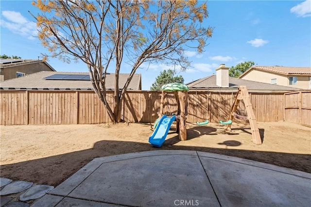 3260 Ivy Ct, Perris, CA 92571 - fenced backyard with a playground and a patio area