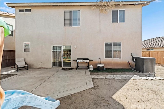 3260 Ivy Ct, Perris, CA 92571 - back of house with central AC unit, stucco siding, and a patio