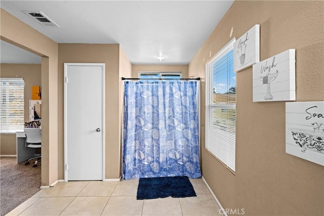 3260 Ivy Ct, Perris, CA 92571 - bathroom with baseboards, tile patterned flooring, and a shower with shower curtain