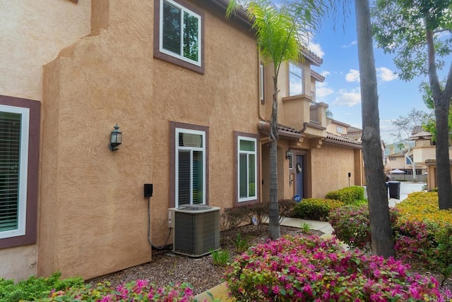 11372 Via Rancho San Diego Unit B, El Cajon, CA 92019 - exterior space featuring central AC and stucco siding