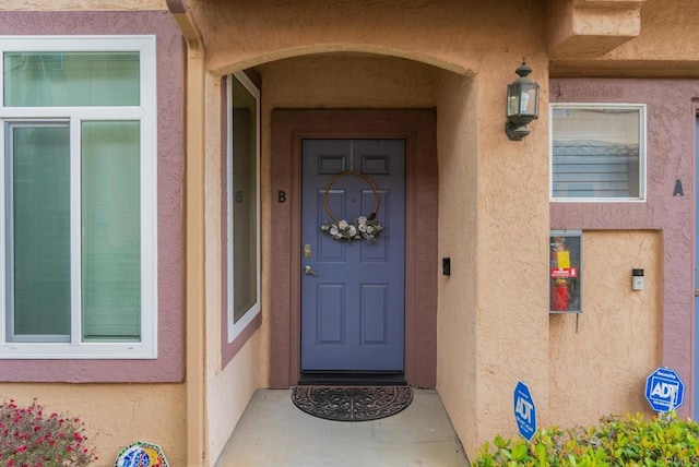 11372 Via Rancho San Diego Unit B, El Cajon, CA 92019 - doorway to property with stucco siding