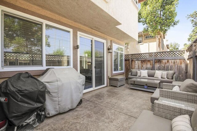 11372 Via Rancho San Diego Unit B, El Cajon, CA 92019 - fenced backyard featuring an outdoor hangout area, a patio area, and a grill
