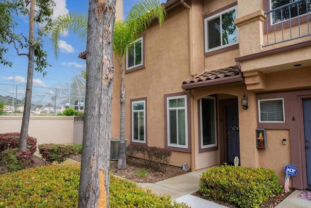 11372 Via Rancho San Diego Unit B, El Cajon, CA 92019 - view of exterior entry featuring stucco siding and a tile roof