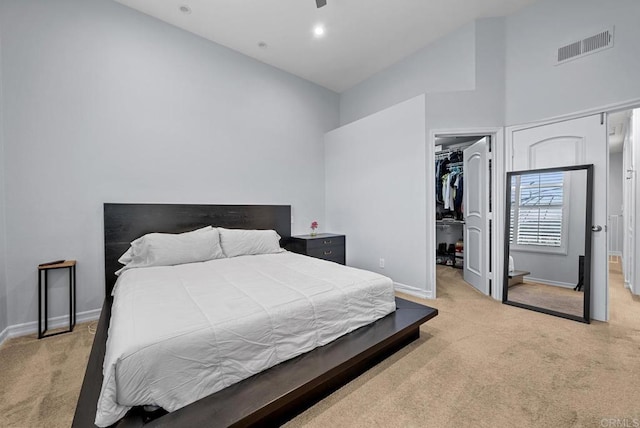 11372 Via Rancho San Diego Unit B, El Cajon, CA 92019 - bedroom with high vaulted ceiling, light carpet, baseboards, a walk in closet, and a closet