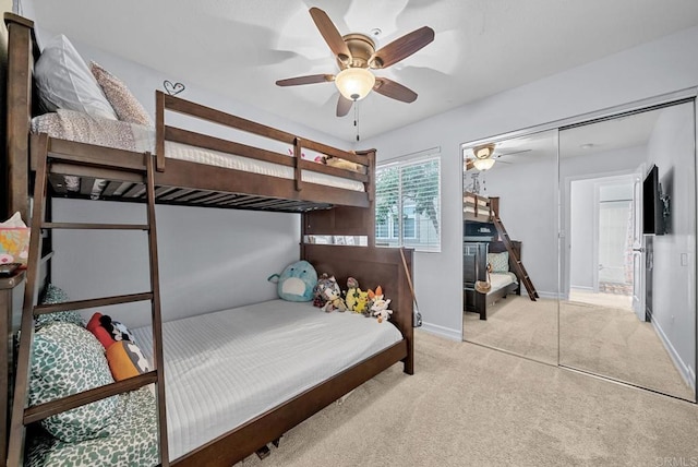 11372 Via Rancho San Diego Unit B, El Cajon, CA 92019 - bedroom featuring light carpet, baseboards, ceiling fan, and a closet