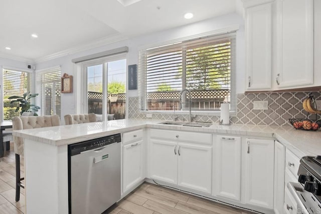 11372 Via Rancho San Diego Unit B, El Cajon, CA 92019 - kitchen featuring dishwasher, a sink, ornamental molding, light countertops, and a breakfast bar