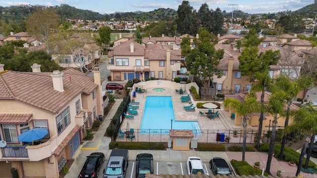 11372 Via Rancho San Diego Unit B, El Cajon, CA 92019 - aerial view of residential area featuring a pool