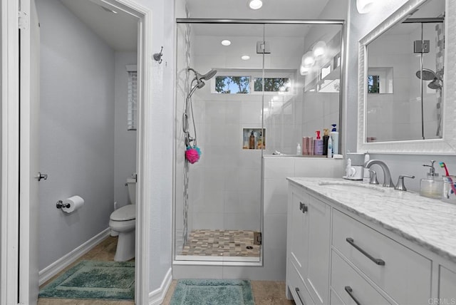 11372 Via Rancho San Diego Unit B, El Cajon, CA 92019 - bathroom featuring a stall shower, toilet, vanity, tile patterned floors, and baseboards