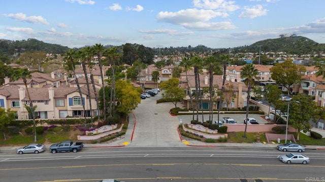 11372 Via Rancho San Diego Unit B, El Cajon, CA 92019 - aerial perspective of suburban area with a mountain backdrop