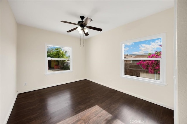 216 E El Segundo Blvd, Los Angeles, CA 90061 - spare room with dark wood-style floors, baseboards, and a ceiling fan