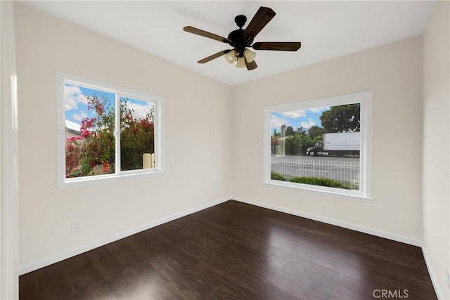 216 E El Segundo Blvd, Los Angeles, CA 90061 - unfurnished room with healthy amount of natural light, dark wood-type flooring, and baseboards