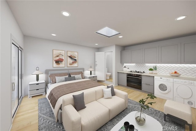 216 E El Segundo Blvd, Los Angeles, CA 90061 - bedroom with a skylight, light wood finished floors, independent washer and dryer, recessed lighting, and connected bathroom