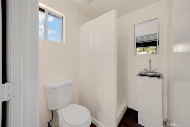 216 E El Segundo Blvd, Los Angeles, CA 90061 - full bath with a stall shower, toilet, a sink, and baseboards