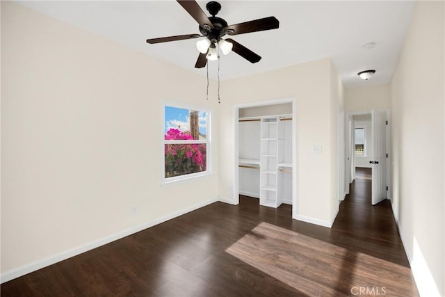 216 E El Segundo Blvd, Los Angeles, CA 90061 - unfurnished bedroom with dark wood-type flooring, a closet, baseboards, and a ceiling fan