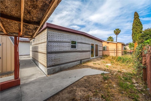 216 E El Segundo Blvd, Los Angeles, CA 90061 - view of side of home featuring a patio area