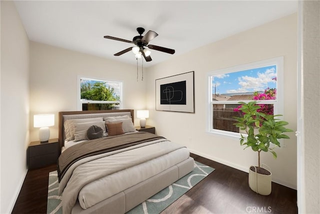 216 E El Segundo Blvd, Los Angeles, CA 90061 - bedroom with baseboards, wood finished floors, and a ceiling fan