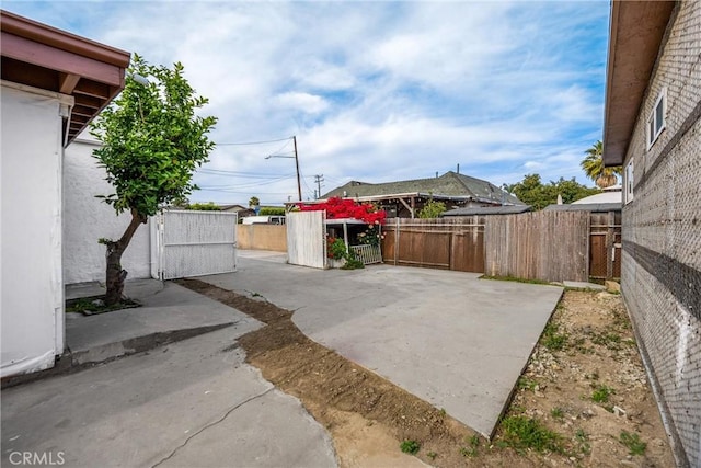 216 E El Segundo Blvd, Los Angeles, CA 90061 - fenced backyard featuring a patio area