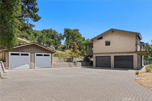 1635 Bee Canyon Rd, Arroyo Grande, CA 93420 - view of side of property with a balcony, a detached garage, and stucco siding