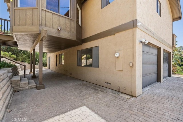 1635 Bee Canyon Rd, Arroyo Grande, CA 93420 - view of side of home featuring stucco siding and a garage