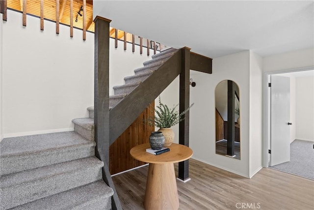 1635 Bee Canyon Rd, Arroyo Grande, CA 93420 - staircase with baseboards, wood finished floors, and arched walkways