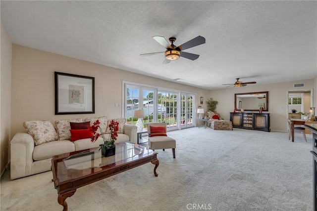 1113 Hollydale Dr, Fullerton, CA 92831 - living area featuring ceiling fan, carpet, and a textured ceiling